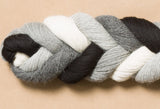 A braid of 5 different hanks: natural, lightest gray, light gray, medium dark gray, and black.